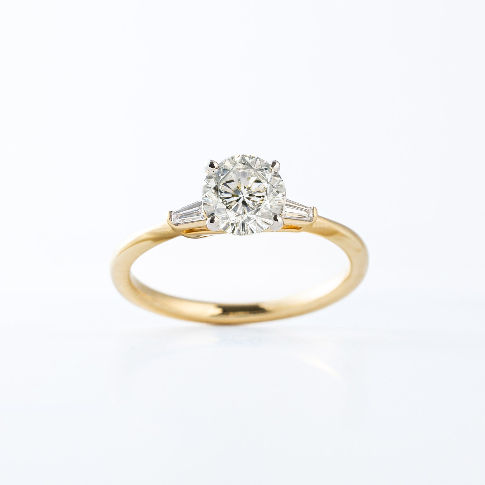 Solitaire Round Engagement Ring with Baguettes