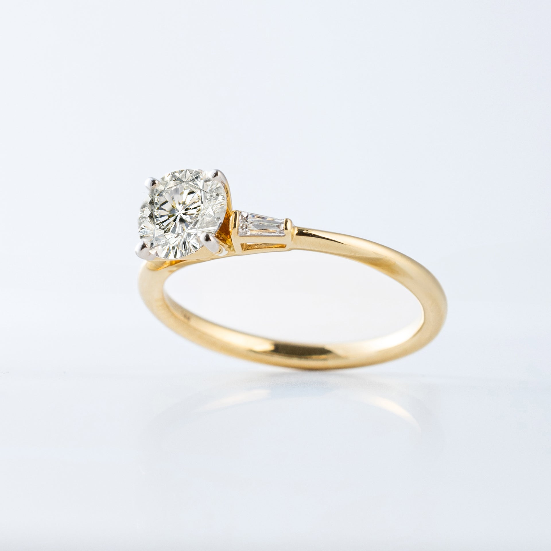 Solitaire Round Engagement Ring with Baguettes